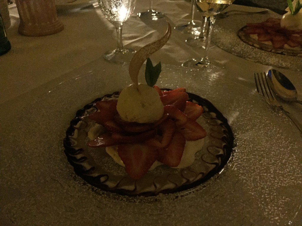 Strawberries on a rhubarb foam and vanilla ice cream.