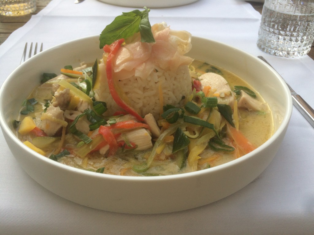 Green Thai curry with pickled ginger, chicken breast slices, asian vegetables and jasmine rice